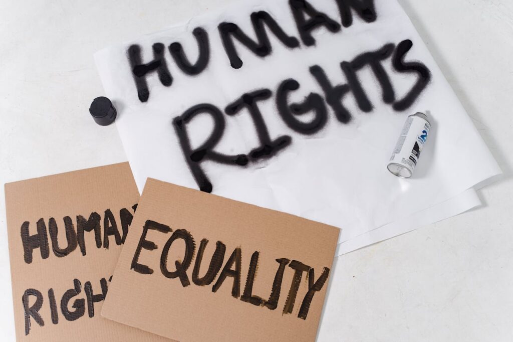 Close-up of protest materials promoting human rights and equality.